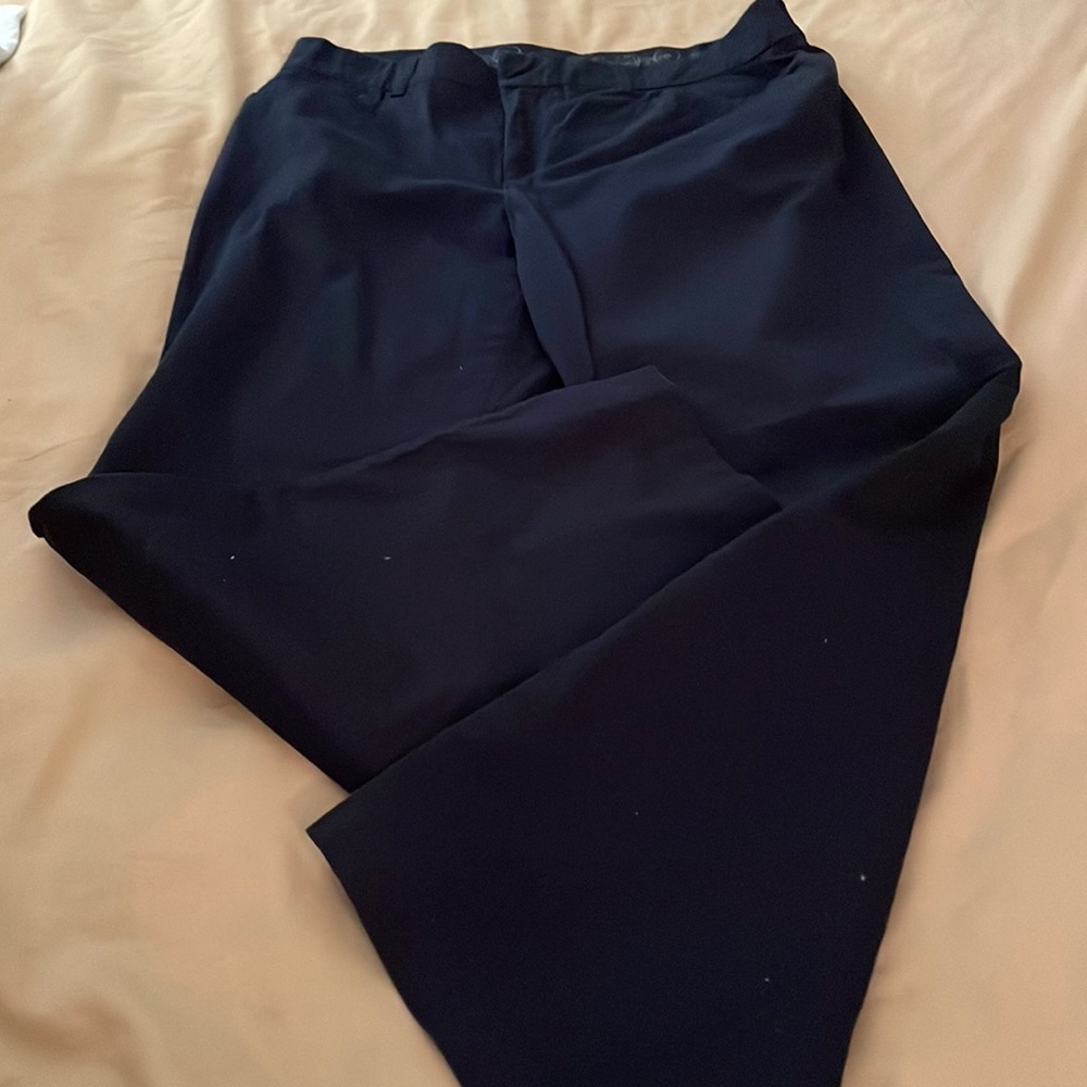 Black pants with front zipper and elastic waistband